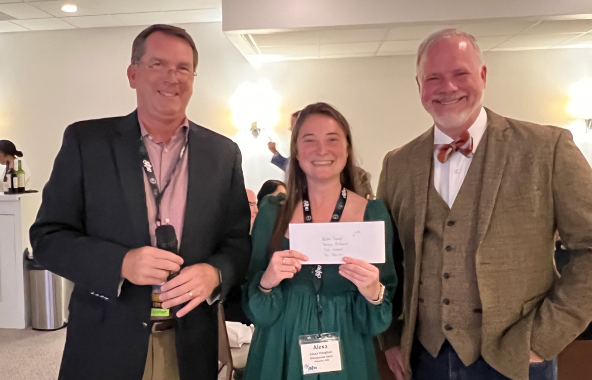 Todd Schultz celebrates with two of the second-place team of Alexa Vaugn of Chesapeake Spice and Patrick McKinney of Life Spice.